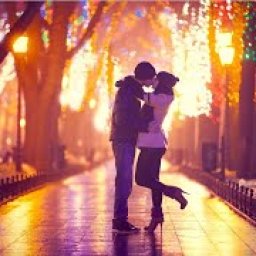 Two lovers Kissing in a city night park